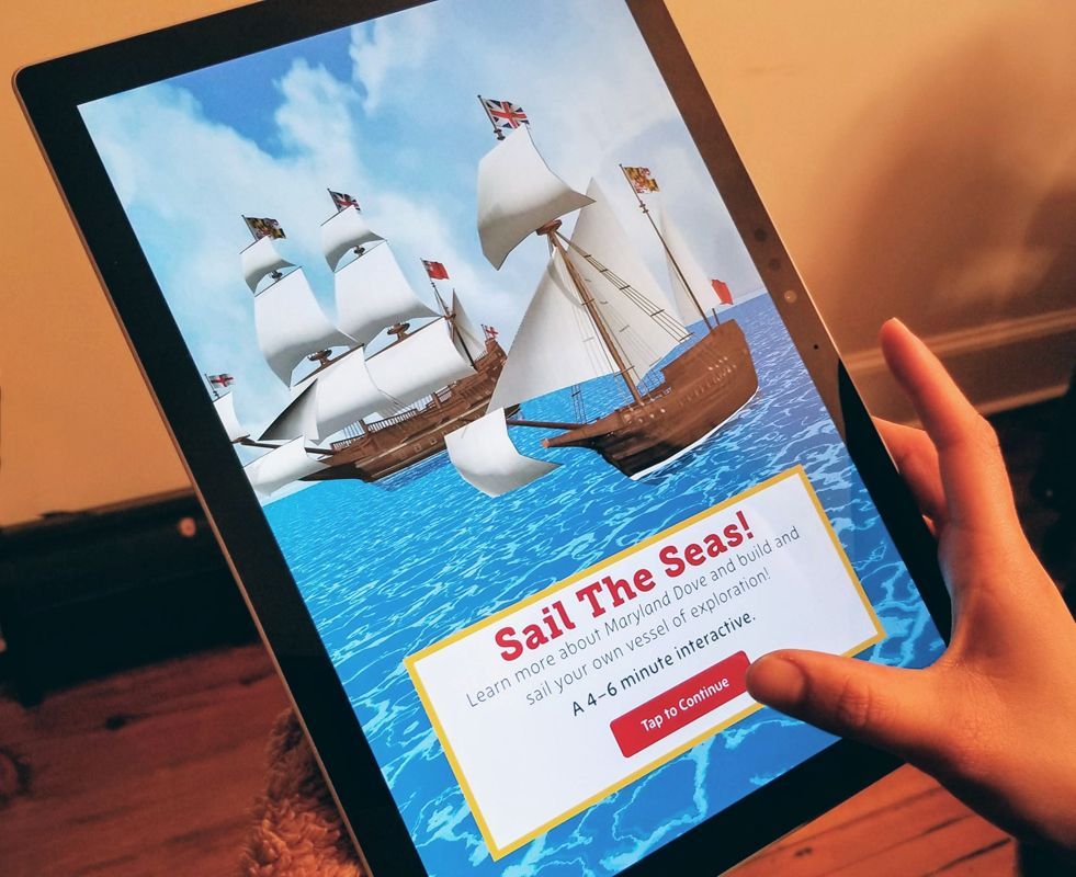 A picture of the interactive at the "sail the seas" screen with two boats on the ocean.